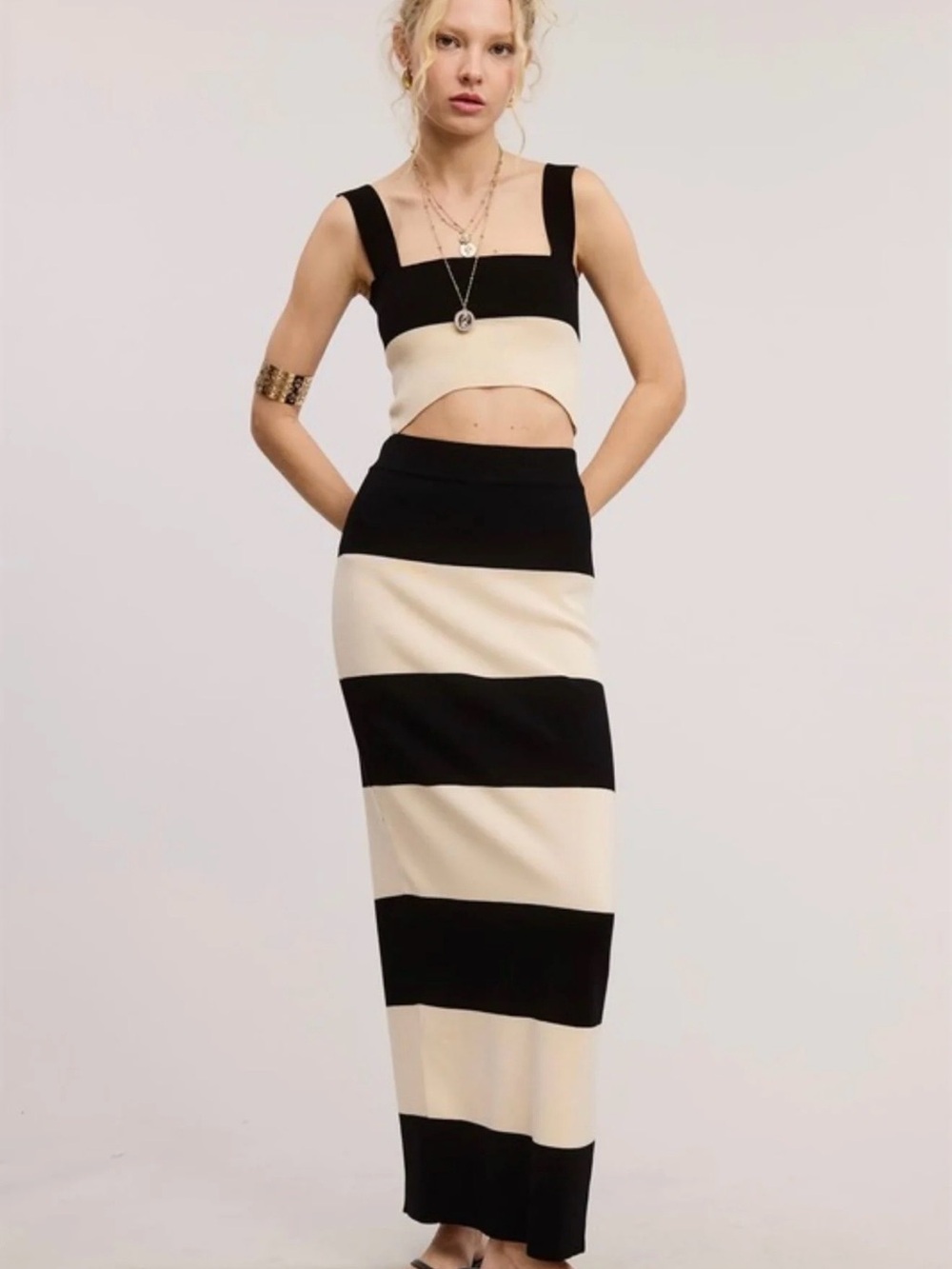 Women's Black and Cream Striped Maxi Skirt and Crop Top Set.